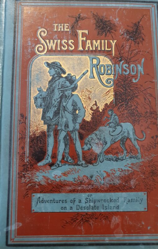 Cover of an edition of The Swiss Family Robinson, showing two men and a parrot on the back of a dog.